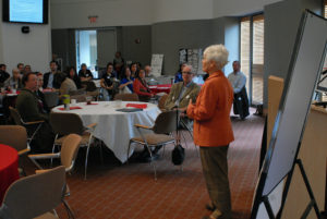 Speaker addressing the room at the food summit