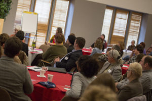 Participants listening to a speaker at the food summit