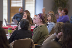 Participants engrossed in food summit presentation