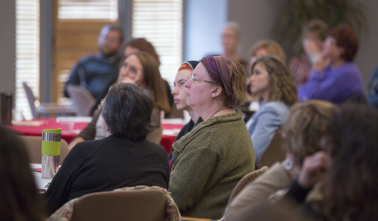 Participants engrossed in food summit presentation
