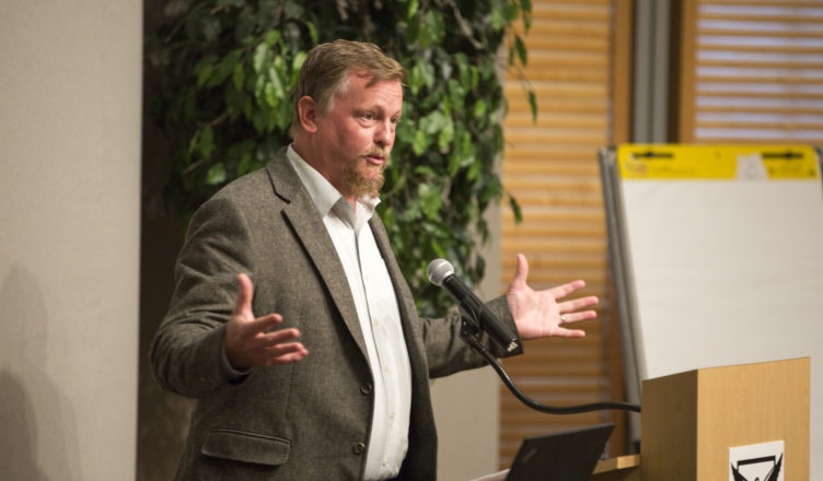 Man speaking to the food summit room