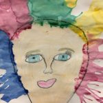 Child's water color painting of a girl's face