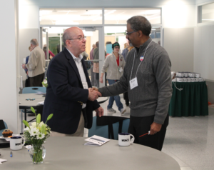 Two participants shaking hands